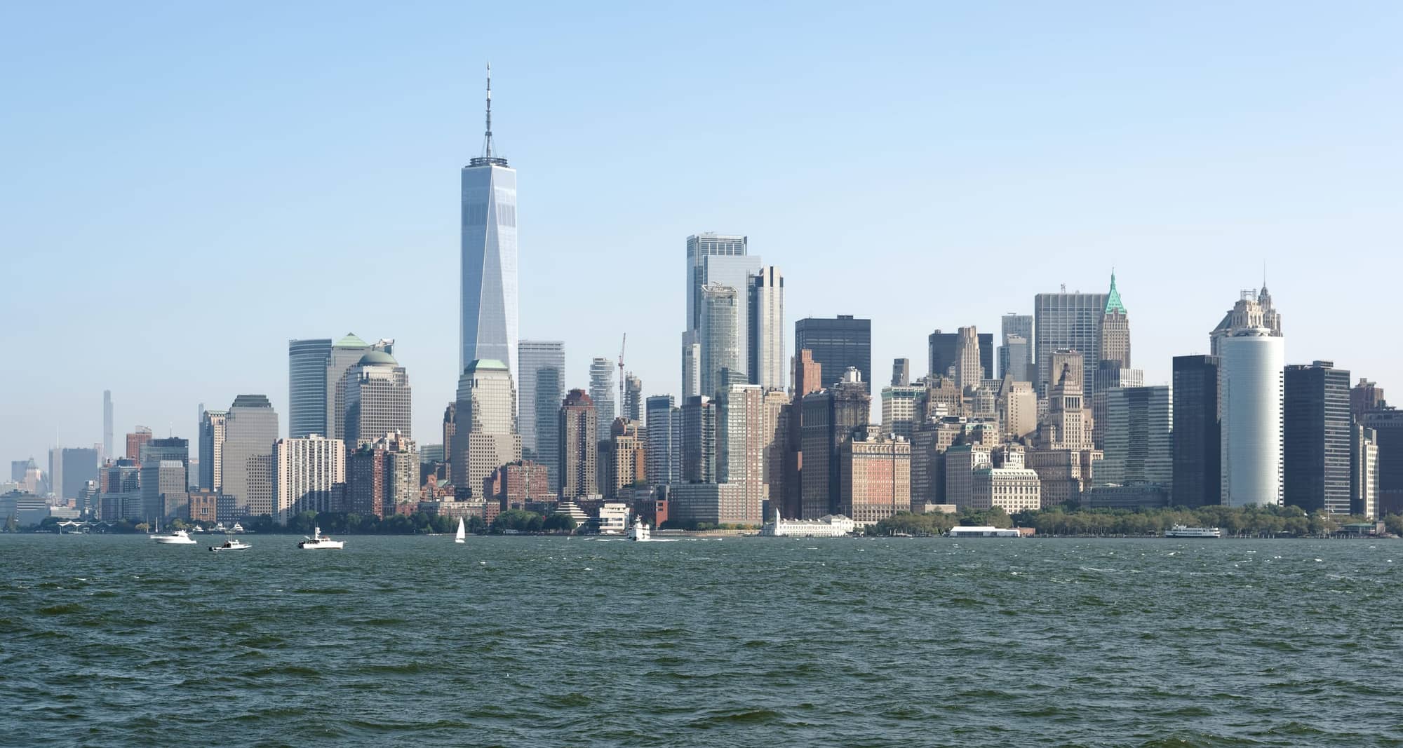 Lower Manhattan skyline with One World Trade Center seen across the water of Upper New York Bay